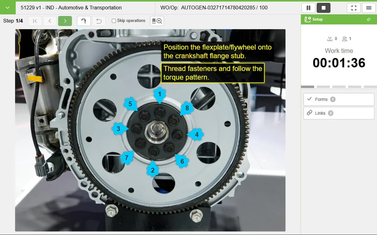 VKS screenshot: flywheel build step with numbered torque-sequence markers and a live work timer.