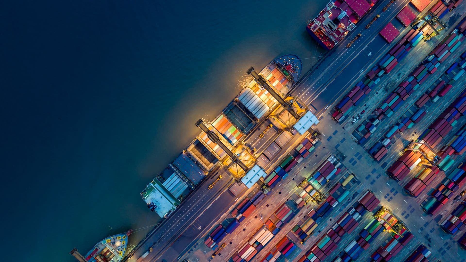 over view of a dock with a lot of containers and some boats