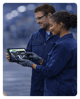 Manufacturing workers looking at a tablet with VKS instructions - Thumbnail