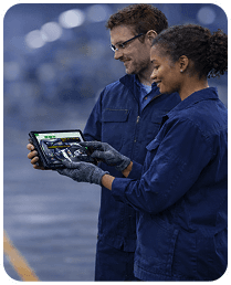 Manufacturing workers looking at a tablet with VKS instructions - Thumbnail